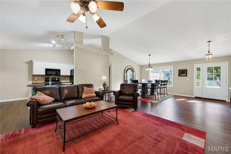 Great Room, Entry Foyer and Dining Room with Wood Flooring and Vaulted Ceilings — 167 Rightfield Drive, O'Fallon, MO 63366