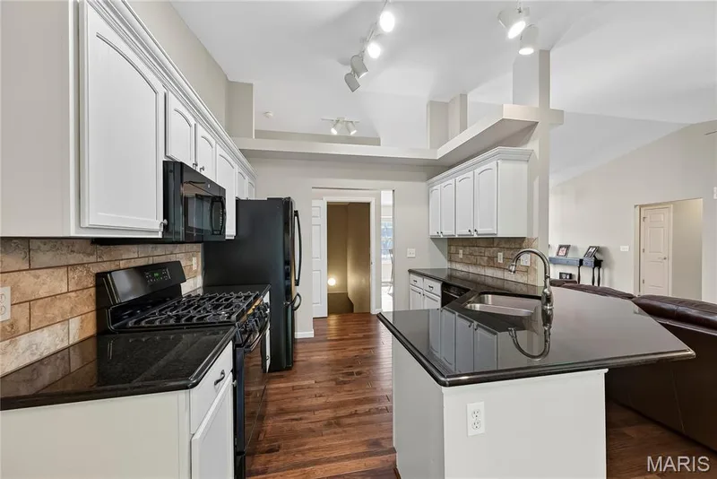 Granite Countertops and Breakfast Bar in Kitchen — 167 Rightfield Drive, O'Fallon, MO 63366