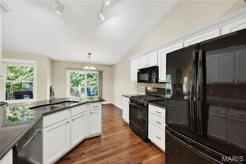 Kitchen open to Breakfast Room — 167 Rightfield Drive, O'Fallon, MO 63366