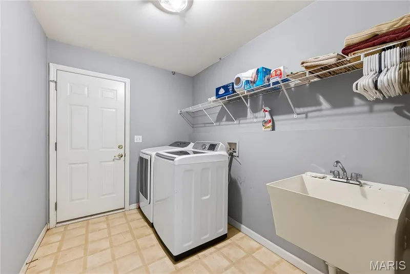 Main Floor Laundry Room with Wash Sink — 167 Rightfield Drive, O'Fallon, MO 63366