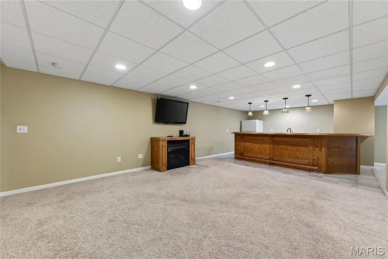 Custom Wet Bar and Family Room in Finished Lower Level — 167 Rightfield Drive, O'Fallon, MO 63366
