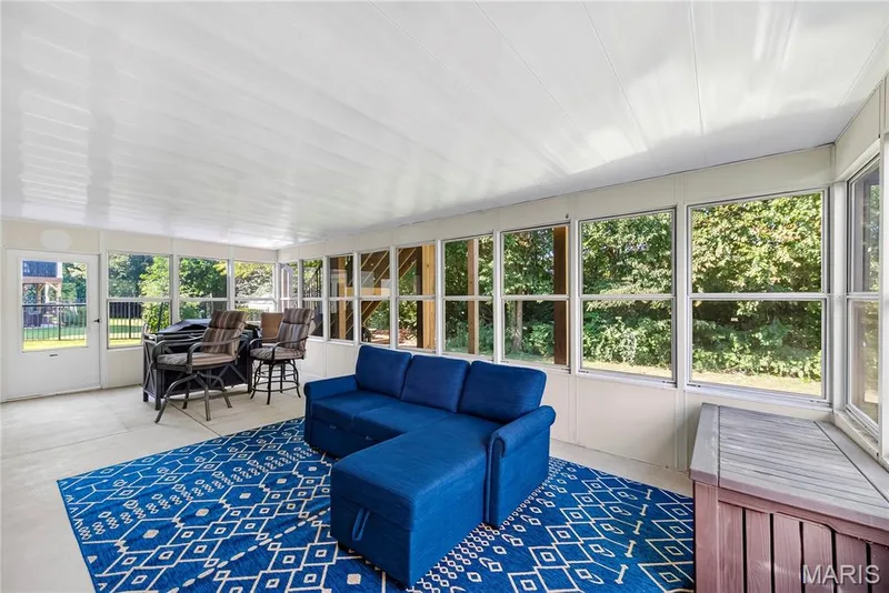 Screened in Patio/ Sunroom with Doors to Backyard on Either Side — 167 Rightfield Drive, O'Fallon, MO 63366