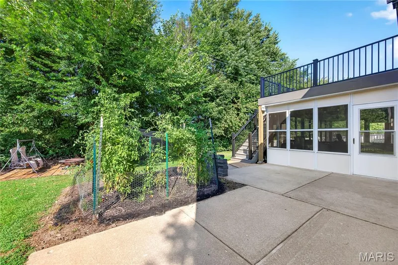 Large Patio, Screened/Glassed in Porch and Composite Deck with Steps to Yard — 167 Rightfield Drive, O'Fallon, MO 63366