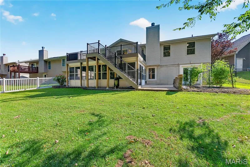 Walk Out Rear Elevation with Composite Deck, Screened in Porch and Patio — 167 Rightfield Drive, O'Fallon, MO 63366