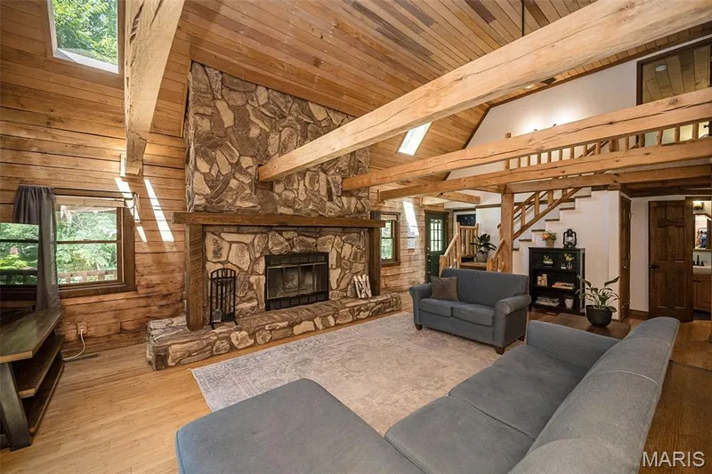 Floor to ceiling stone wood burning fireplace — 8 Whippoorwill Court, Defiance, MO 63341