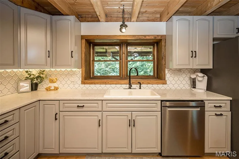 Custom backsplash and cabinetry — 8 Whippoorwill Court, Defiance, MO 63341