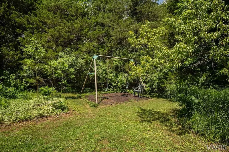 Front yard area with swings — 8 Whippoorwill Court, Defiance, MO 63341