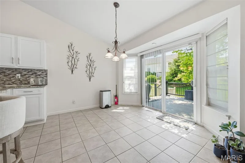 Breakfast room with easy access to the back deck and seating area — 214 Charging Bear Drive, Wentzville, MO 63385