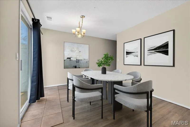 Breakfast room with a sliding door the the back patio — 352 Windsor Place #B, St Peters, MO 63376