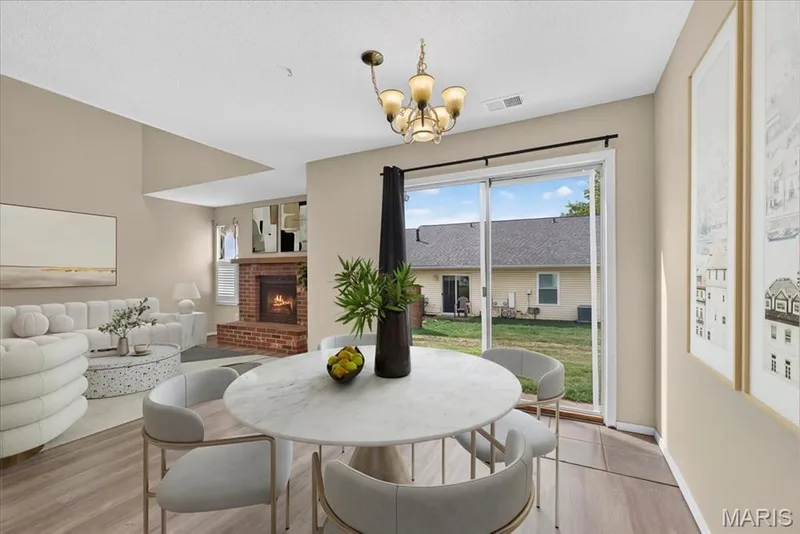 Breakfast room with a sliding door to the back patio — 352 Windsor Place #B, St Peters, MO 63376