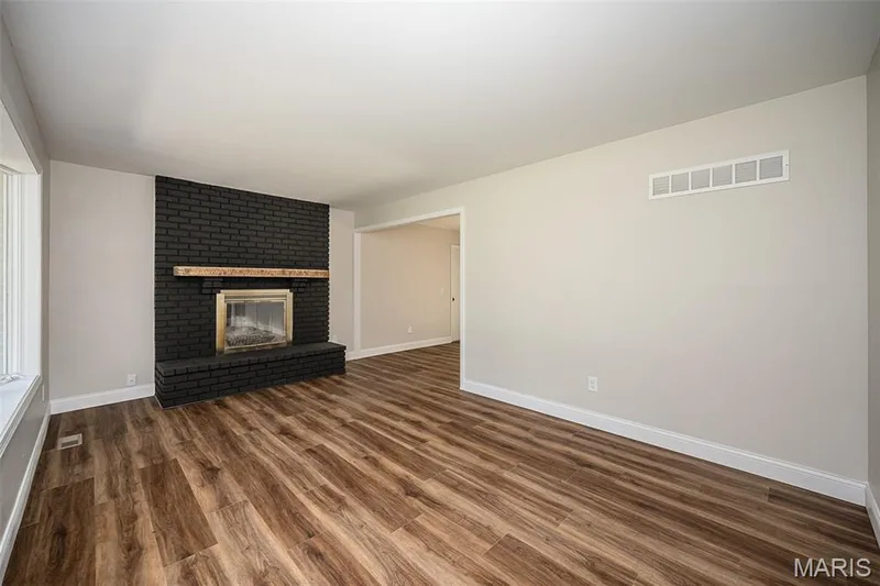 Living room with wood burning fireplace — 5935 Lafayette Drive, Weldon Spring, MO 63304