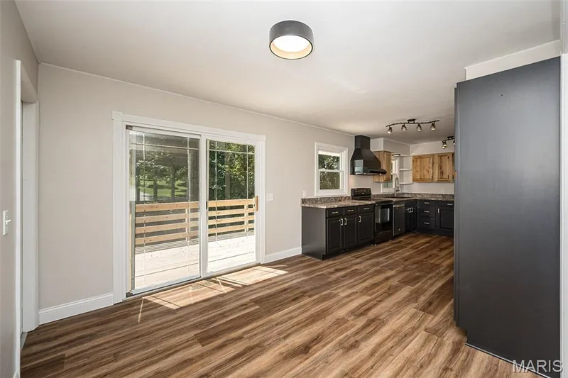 Breakfast room and kitchen, updated lighting and flooring — 5935 Lafayette Drive, Weldon Spring, MO 63304