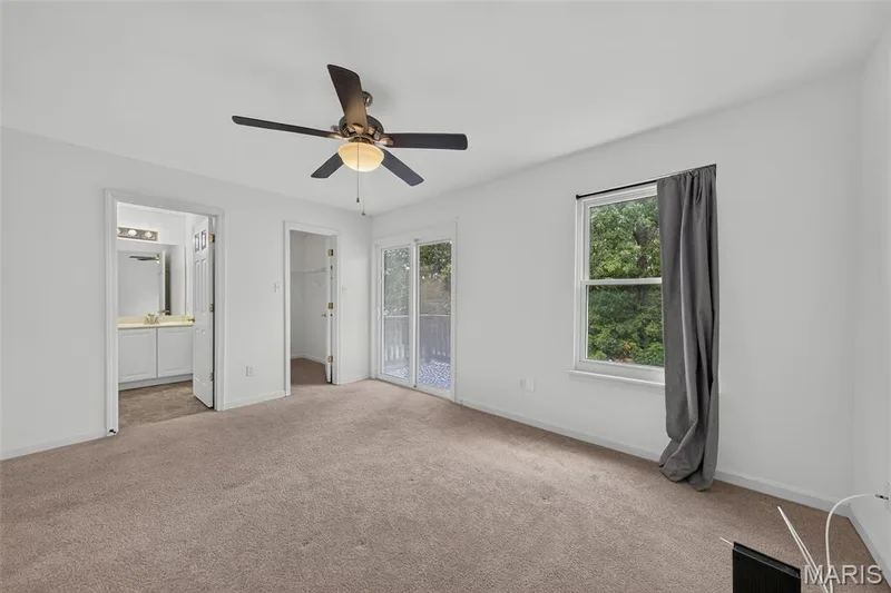 Walk in Closet, walks out to deck and has a primary bathroom with double sinks. — 101 Timber Creek Drive, O'Fallon, MO 63368