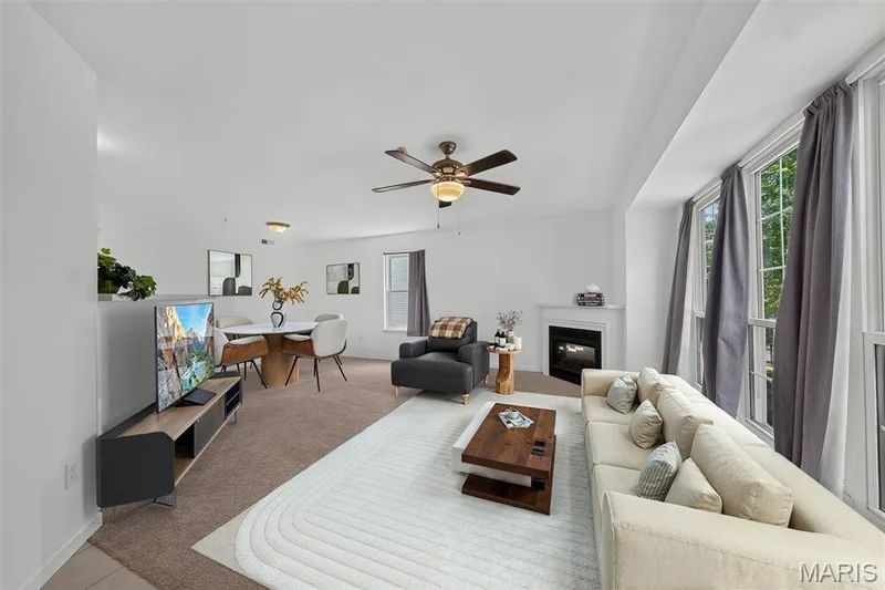 Virtually Staged. Great room, wall of windows, electric fireplace, open floor plan — 101 Timber Creek Drive, O'Fallon, MO 63368