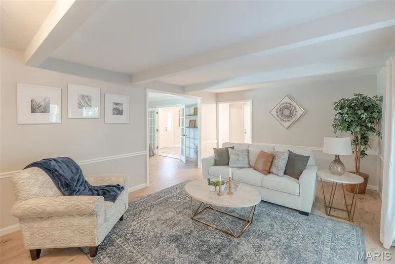Recessed lighting, wood-finish flooring, crown molding, chair rail detailing, and French doors — 1526 Candish Lane, Chesterfield, MO 63017