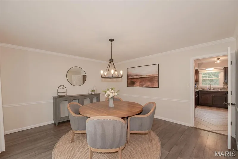 Wood-finish flooring, crown molding, and wainscoting details — 1526 Candish Lane, Chesterfield, MO 63017