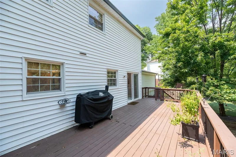 Expansive rear deck with wood-finish flooring and solid railings — 1526 Candish Lane, Chesterfield, MO 63017