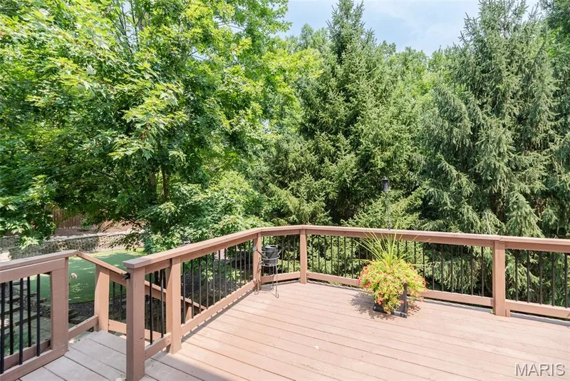 Spacious wood-finish deck with dark-toned railings — 1526 Candish Lane, Chesterfield, MO 63017
