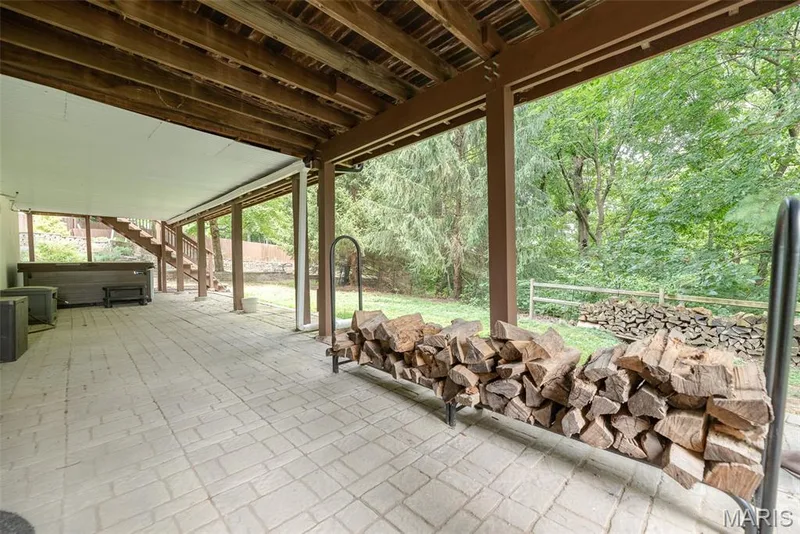 Covered patio with paver flooring and wood beam ceiling — 1526 Candish Lane, Chesterfield, MO 63017
