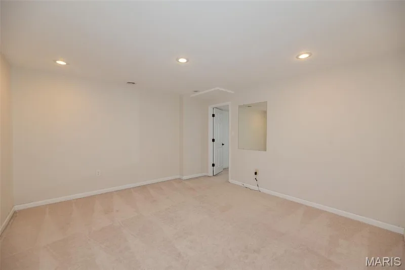 Recessed ceiling lighting, wall-to-wall carpeting, and a built-in wall mirror — 1526 Candish Lane, Chesterfield, MO 63017