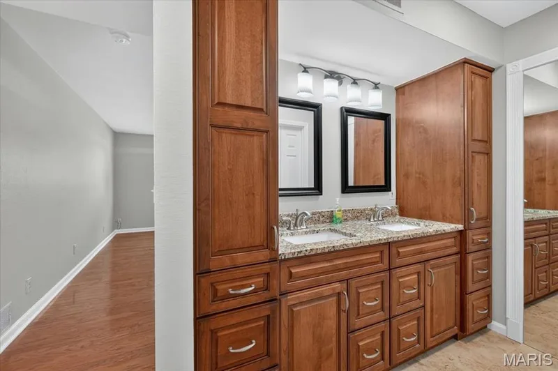 Primary bath has a double bowl vanity & a lot of storage. — 1380 Heritage Landing #202, St Charles, MO 63303