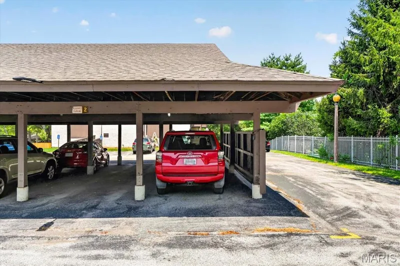 Reserved carport #1. There is also unassigned and quest parking. — 1380 Heritage Landing #202, St Charles, MO 63303