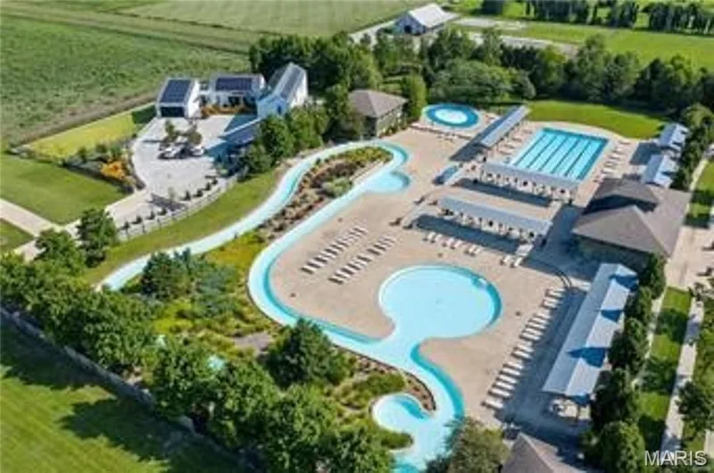 Expansive aquatic recreation area featuring a lap pool, a meandering lazy river, and multiple resort-style pools — 3429 Sublette Street, St Charles, MO 63301