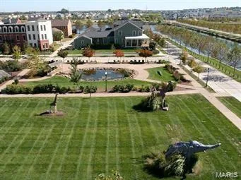 Expansive green space featuring sculpted landscaping and decorative statues — 3429 Sublette Street, St Charles, MO 63301