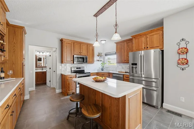 Stainless steel appliances and an eat in kitchen — 2 Emmons Court #1294, O'Fallon, MO 63368