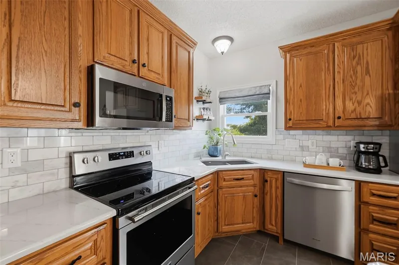Corner sink with backyard views — 2 Emmons Court #1294, O'Fallon, MO 63368