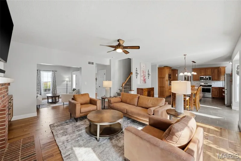 Open concept main level living room to kitchen — 2 Emmons Court #1294, O'Fallon, MO 63368