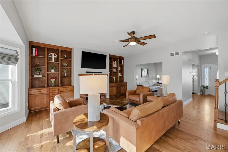 Custom built-in shelving and cabinets surrounding the fireplace — 2 Emmons Court #1294, O'Fallon, MO 63368
