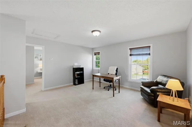 Spacious upper-level loft offers flexible space for work or relaxation. — 2 Emmons Court #1294, O'Fallon, MO 63368