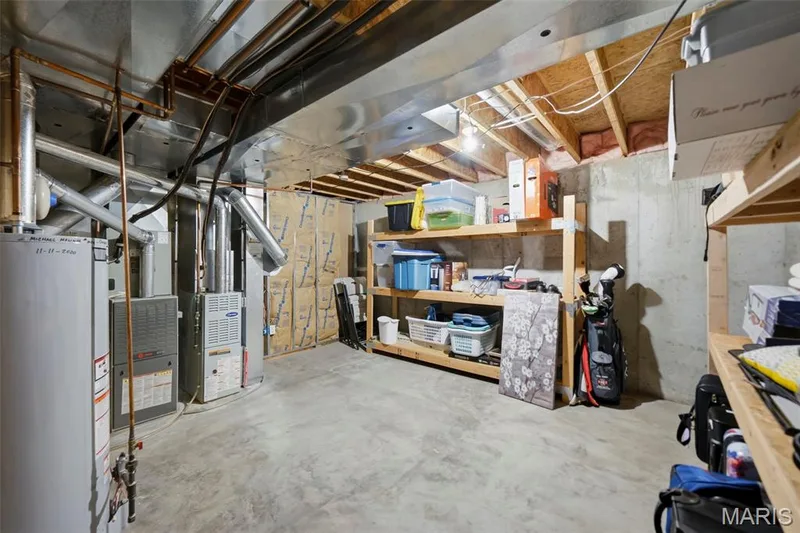 Unfinished storage area with shelves — 2 Emmons Court #1294, O'Fallon, MO 63368