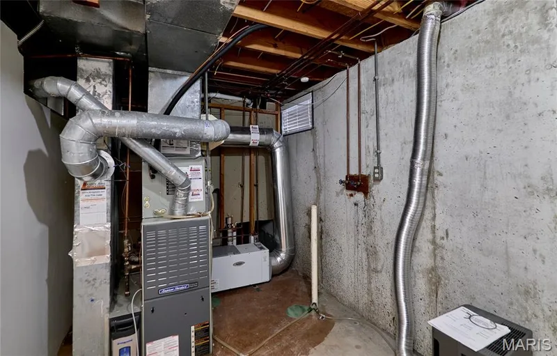 Utility room with laundry hook-up, gas furnace with humidifier and air filtration system — 146 Old Buggy Court #A, St Charles, MO 63304