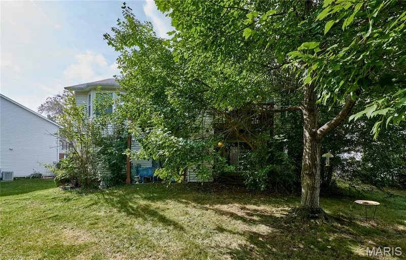 Manicured lawn with mature trees — 146 Old Buggy Court #A, St Charles, MO 63304