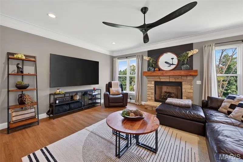 Great Room with Gas Fireplace and Stone Surround — 517 Stonewolf Creek Drive, Wentzville, MO 63385
