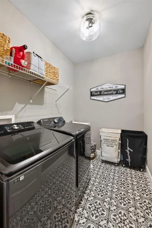 Main Floor Laundry Room with Wash Sink — 517 Stonewolf Creek Drive, Wentzville, MO 63385