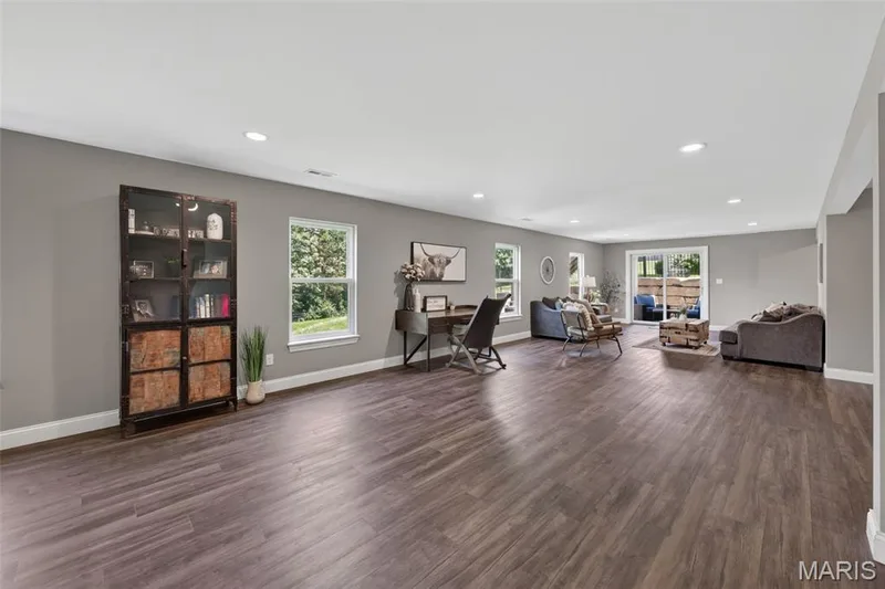 Finished Lower Level with Luxury Vinyl Plank Flooring and Recessed Lighting — 517 Stonewolf Creek Drive, Wentzville, MO 63385