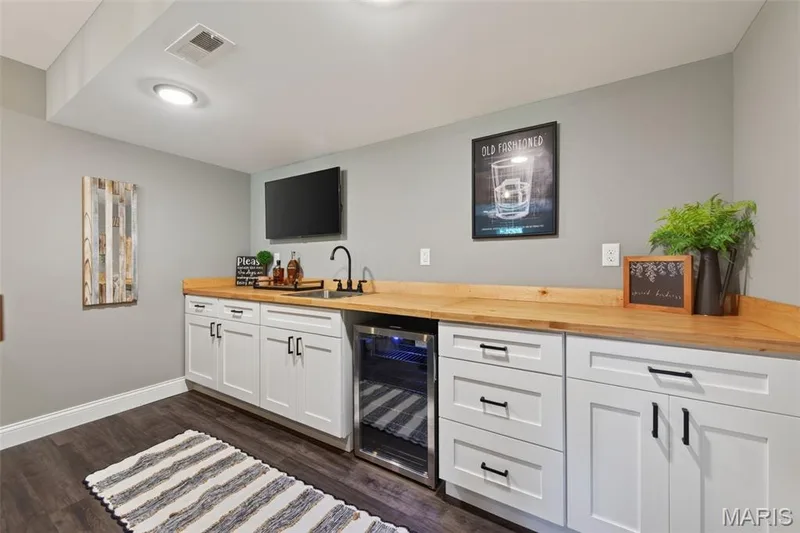 Wet Bar in the Finished Lower Level (Beverage Fridge is Included) — 517 Stonewolf Creek Drive, Wentzville, MO 63385
