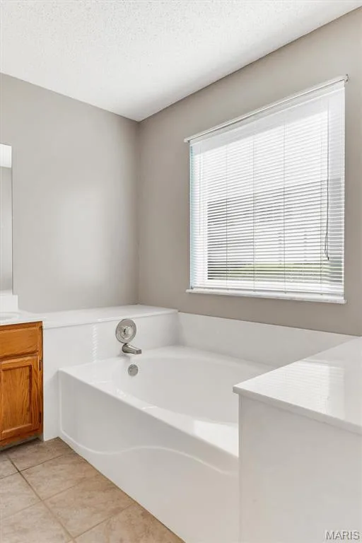 Master bath has separate shower and soaking tub — 3005 Cedarshade Court, St Peters, MO 63376