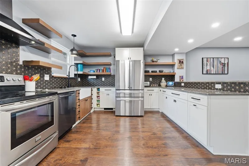 Updated kitchen with granite countertops and stainless appliances — 13473 Coliseum Drive, Chesterfield, MO 63017