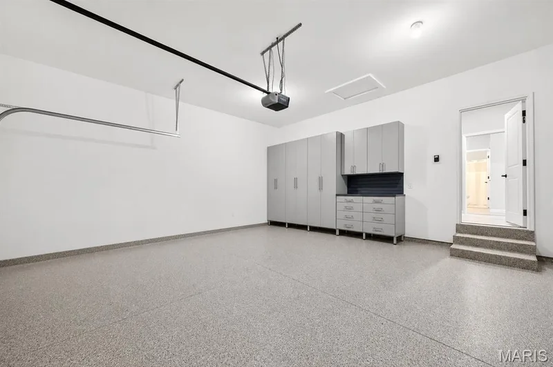 Epoxy flooring in garage with built in cabinets — 204 Randlin Drive, Lake St. Louis, MO 63367