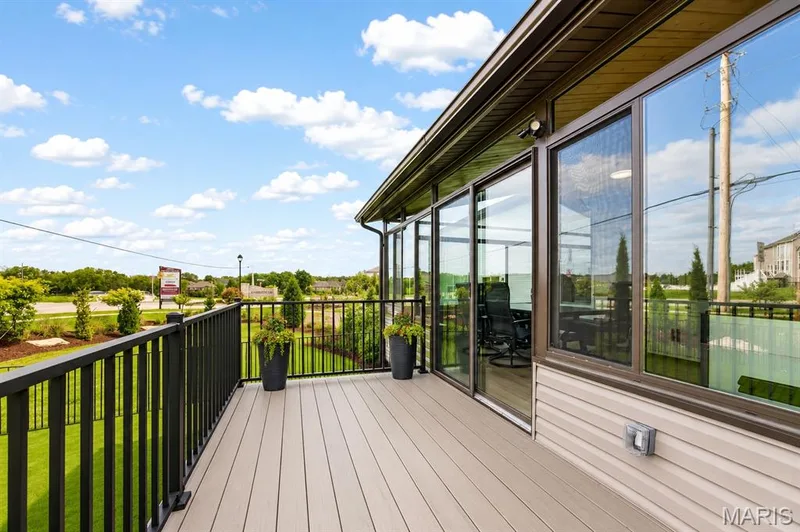 Maintenance free deck outside the four seasons room with stairs to yard — 204 Randlin Drive, Lake St. Louis, MO 63367