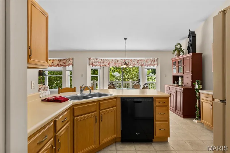 Kitchen looking into breakfast room  and walk-out bay — 8 Autumn Grove Court, O'Fallon, MO 63366