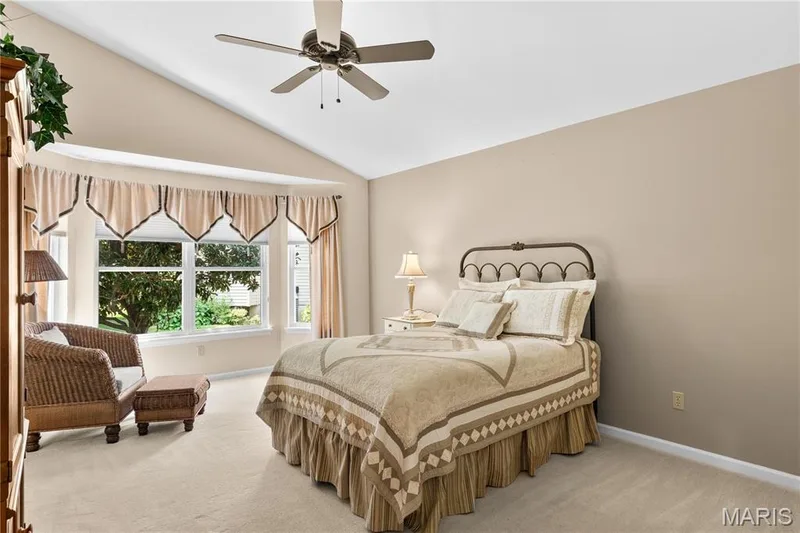 Primary bedroom with bay window and vaulted ceilings — 8 Autumn Grove Court, O'Fallon, MO 63366