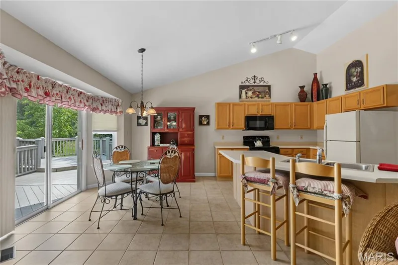 Breakfast area showing kitchen and breakfast bar — 8 Autumn Grove Court, O'Fallon, MO 63366