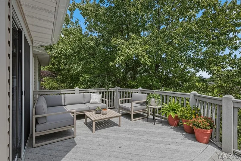 Virtually staged view of deck with trees surrounding it for maximum privacy — 8 Autumn Grove Court, O'Fallon, MO 63366