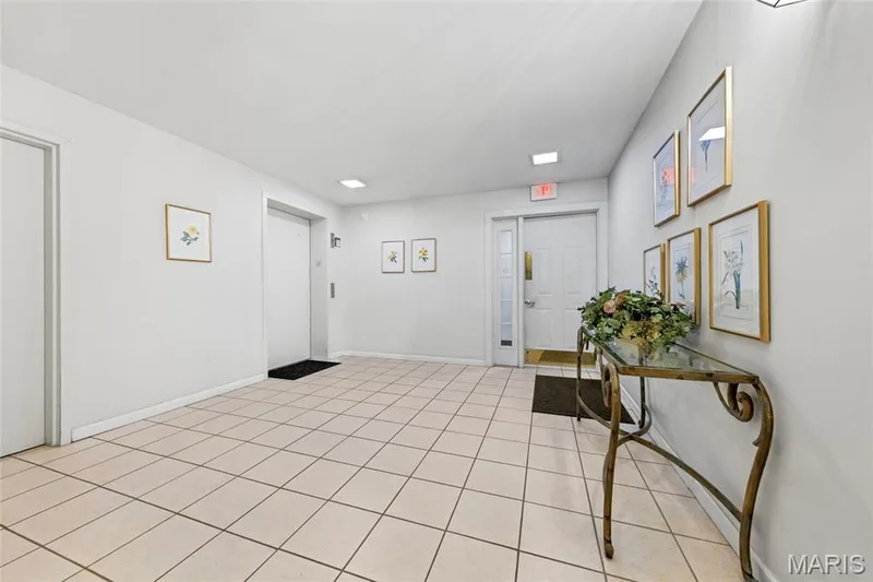 Door from garage to elevator. — 1610 Lake Knoll Drive #1N, Lake St. Louis, MO 63367