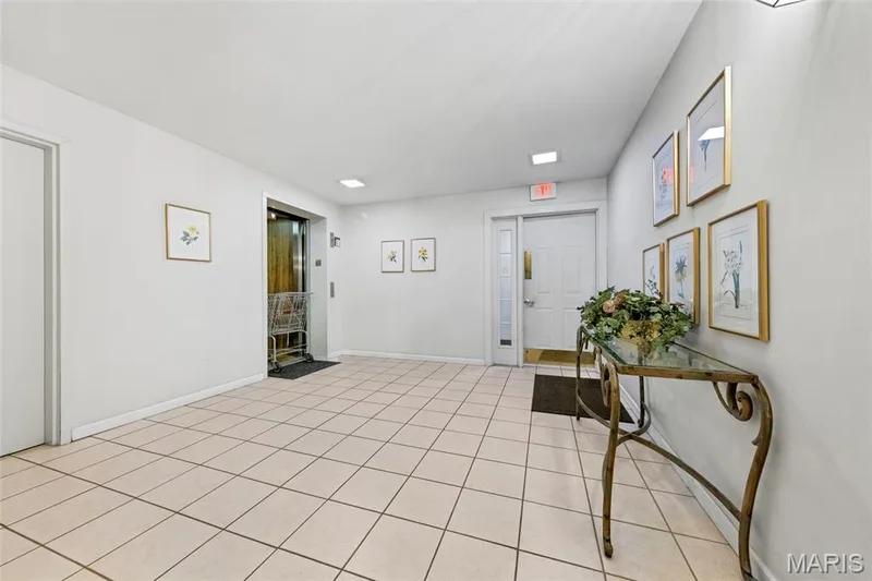 Door from garage to elevator. — 1610 Lake Knoll Drive #1N, Lake St. Louis, MO 63367